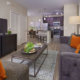 Living room and kitchen open floor plan at Nona Place apartment